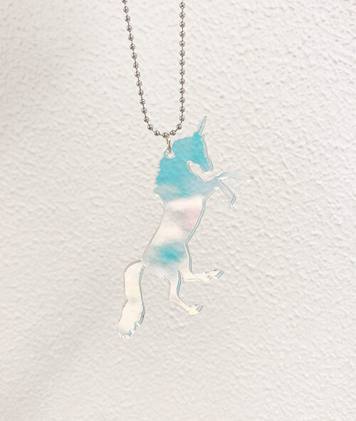 Unicorn shaped pendant in iridescent acrylic.