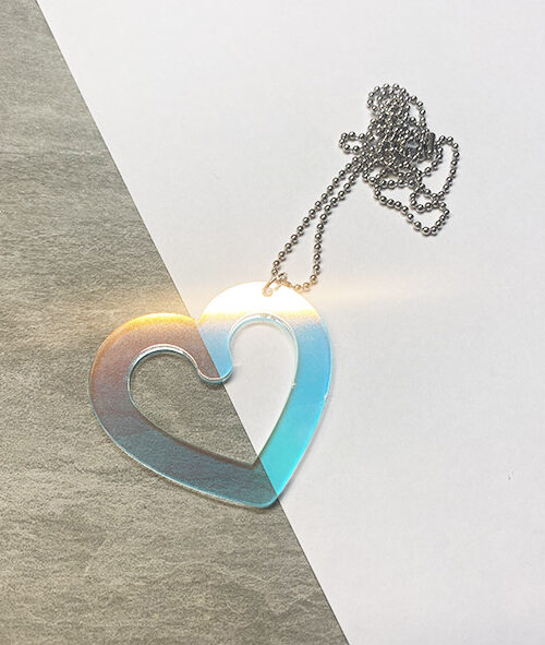 Heart shaped pendant in iridescent acrylic.