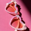 Sydämen malliset vaaleanpunaiset aurinkolasit helmi ja timanttikoristeilla titiMadam